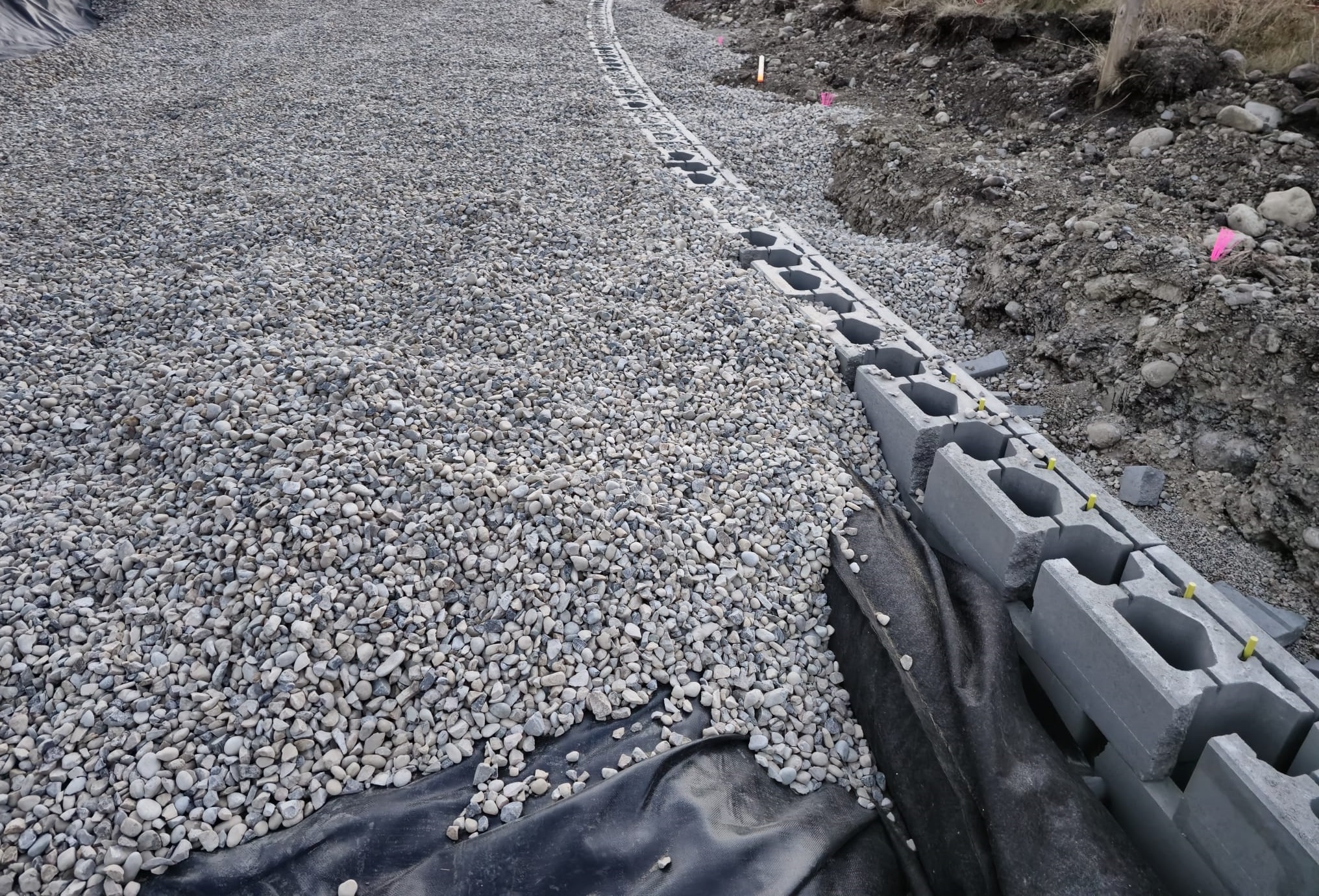 Lock-block wall build-up with geogrid reinforcement layers, Rocky Ridge Calgary